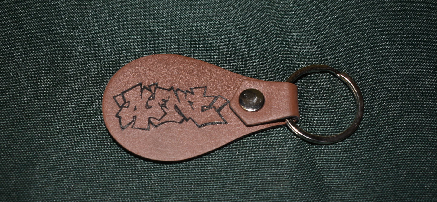 AGENT KEYCHAIN LEATHER BURNED TAGGED