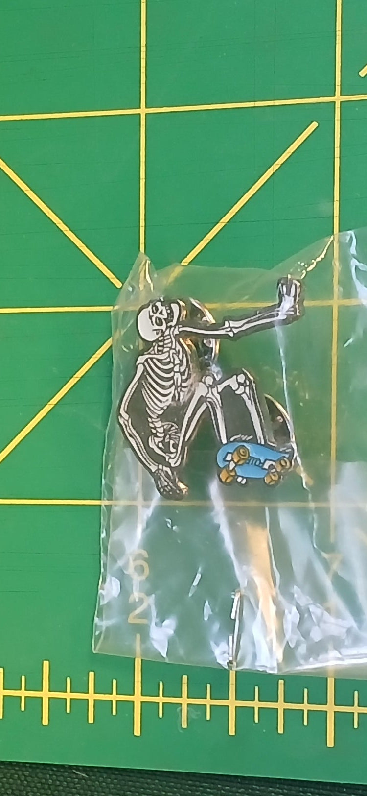 POWELL SKELETON HAND PLANT GLOW IN DARK LAPEL PIN