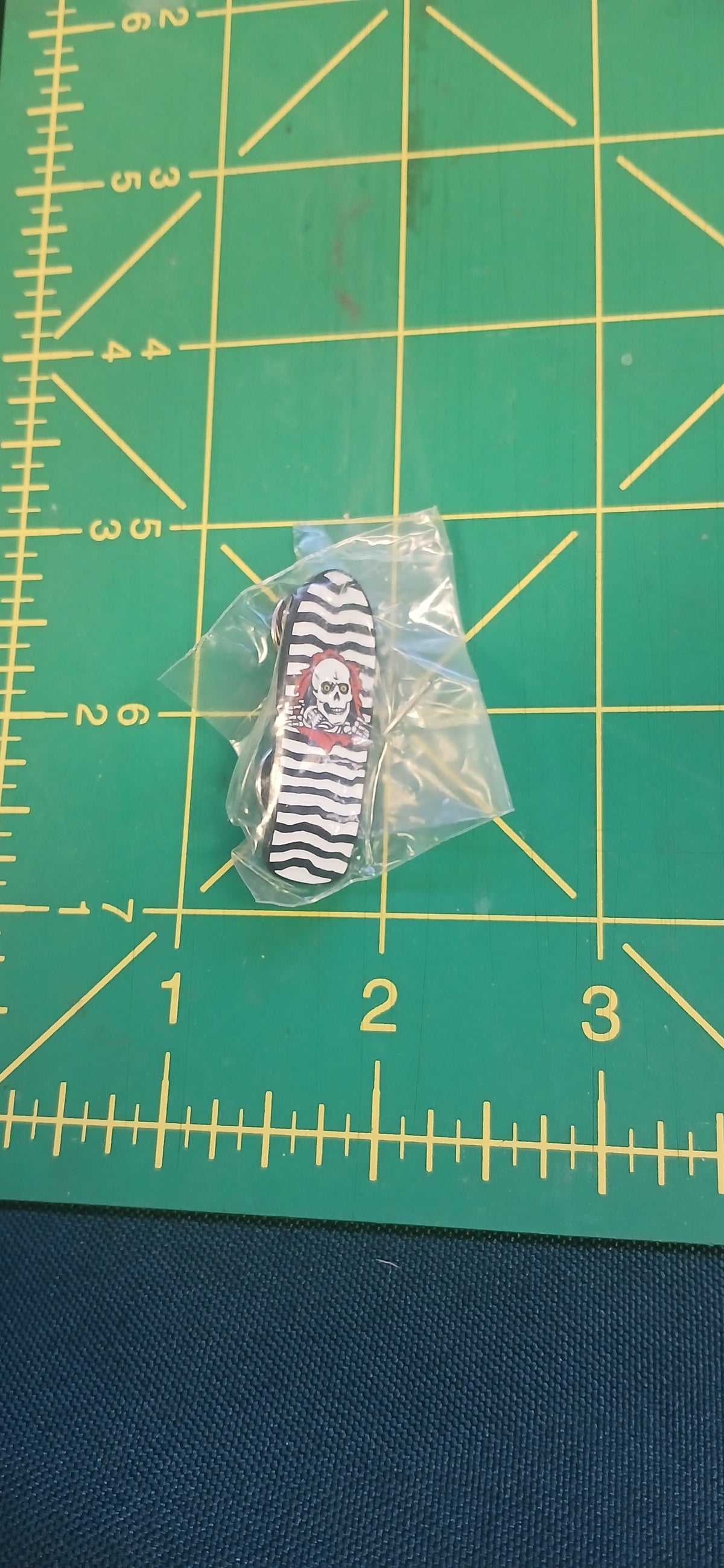 PIN POWELL OG RIPPER DECK WHITE LAPEL PIN